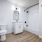 shower/tub combo in well lit bathroom