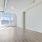 long living room with picture window at one end