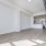 spacious living room next to kitchen