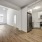 large window brightens living room adjacent to kitchen