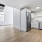Living space with spiral staircase next to kitchen