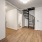 Spiral staircase next to bathroom and entryway