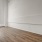 spacious bedroom with ac unit and large, bright windows