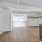 large upstairs living area with balcony overlooking first floor