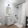 herringbone tiling in well lit bathroom
