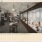 large glass case displays of table cloths, runners, blankets, etc, in the art embroideries salon in Luckey Platt & Co.