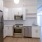lighted kitchen open to hall